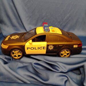 Number 1 in Gadgets Friction-Powered Police Car Toy, Lights & Siren
